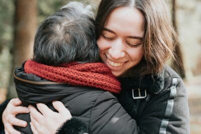 Hugging Women Embrace Connection