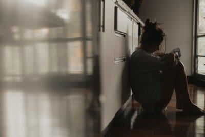 Giving up surrender depression woman sitting down on floor