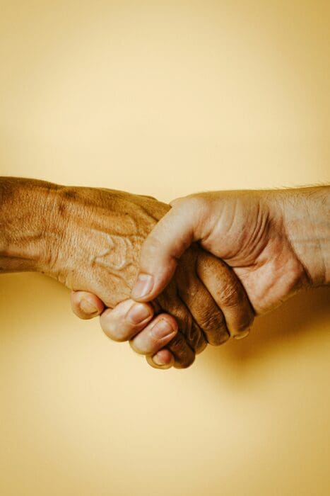 Handshake Two Hands Yellow Background