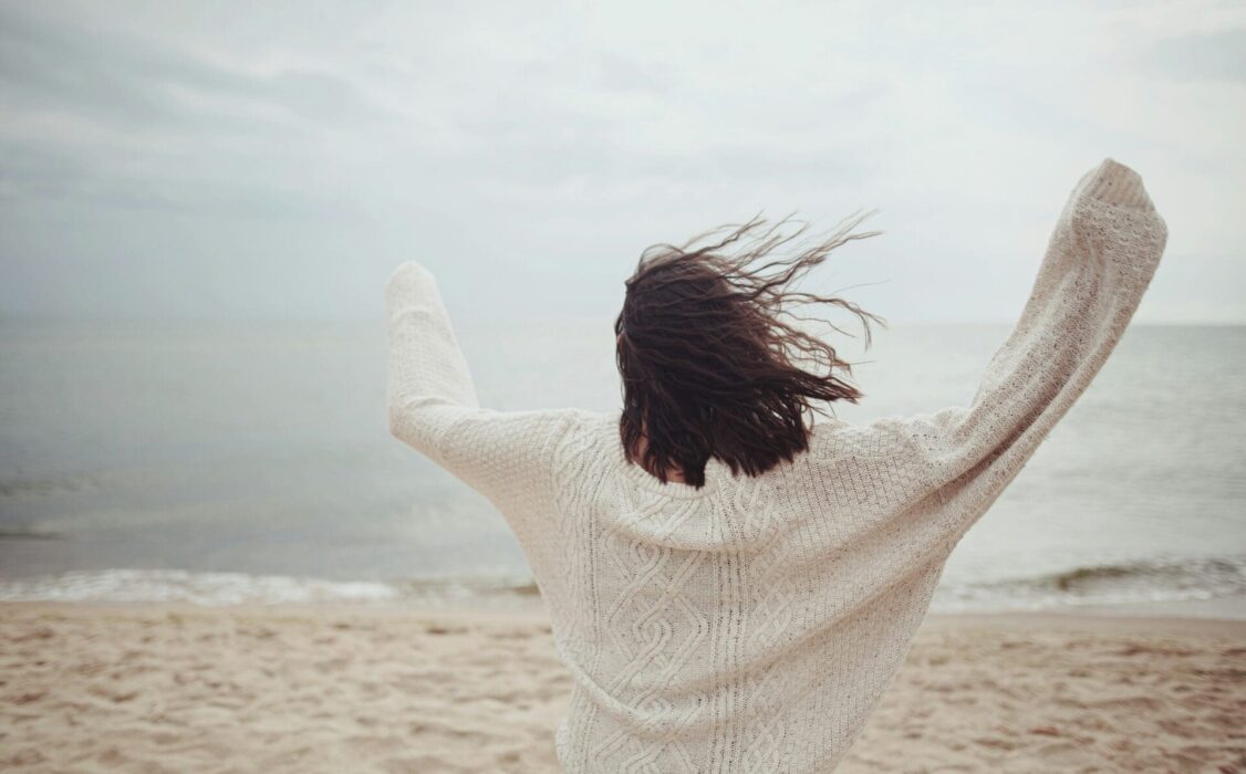 Freedom dancing woman beach