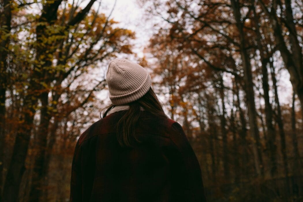 Woman Looking Up Fall Trees Woods Landscape