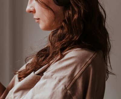 Listening Headphones Looking Down Woman