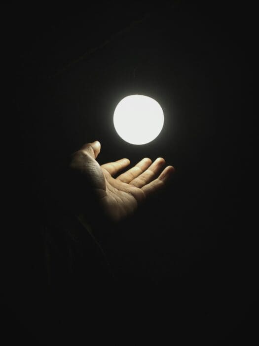 Light in Darkness Bulb Hand