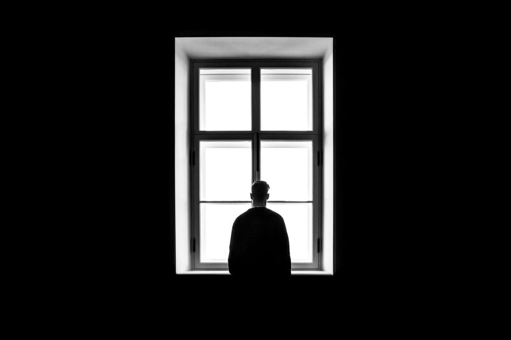 Man standing in window
