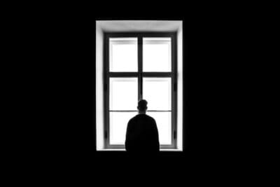 Man standing in window