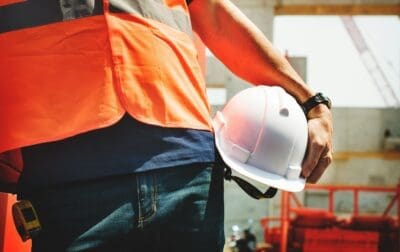 Construction Worker Holding Construction Hat