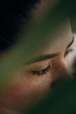 An extreme close-up of a closed eye and lashes, a picture of the fear that comes from looking only at what we see